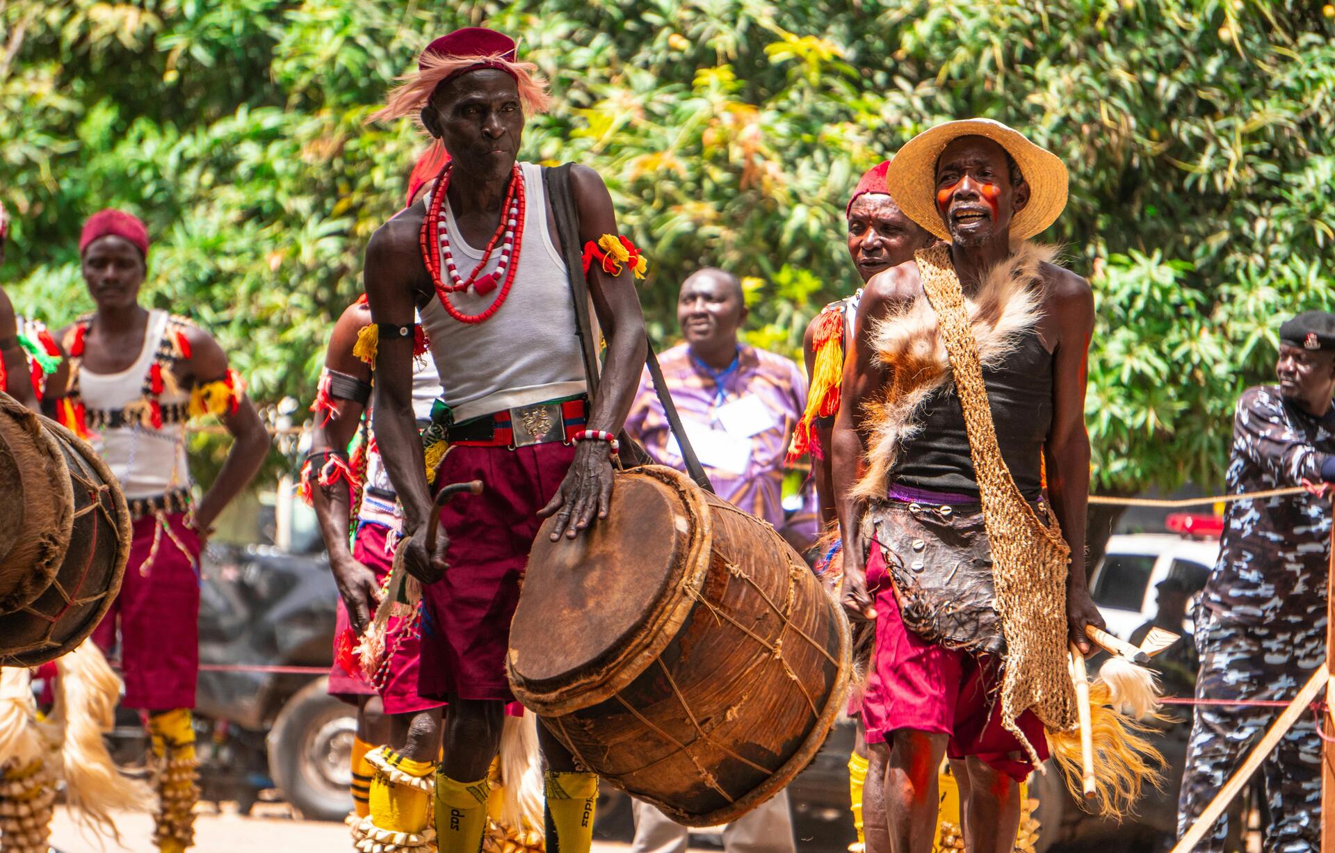 crowd of people playing instruments in nigerian traditional clothing